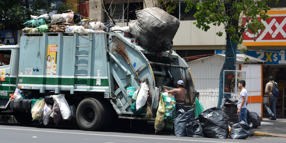Municipal waste collection vehicle on a city street