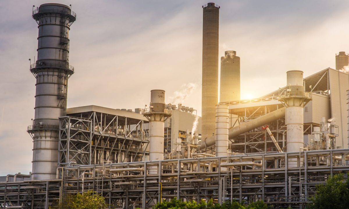 low-angle-view-factory-against-sky-sunset